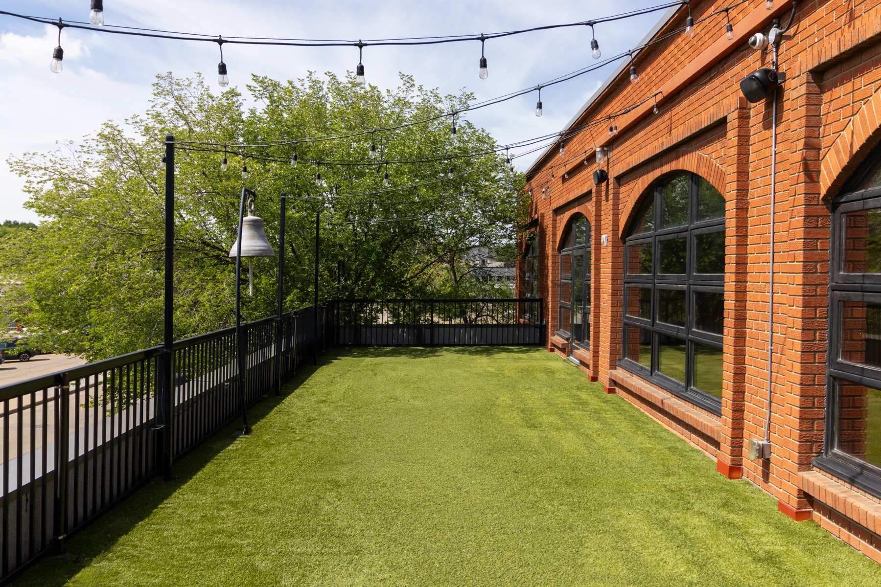 The Bell rooftop patio with string lights