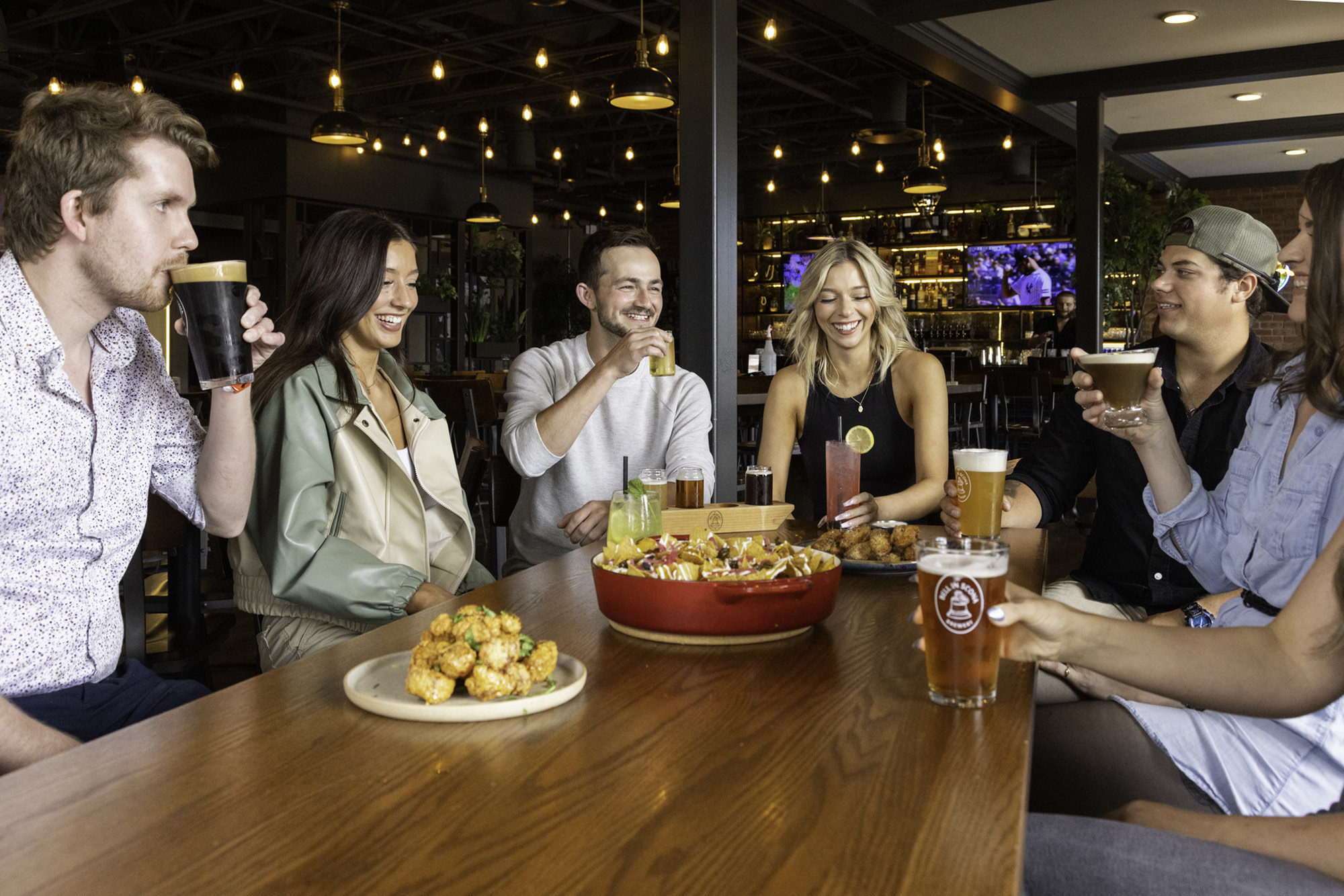 A group gathered and celebrating at The Bell