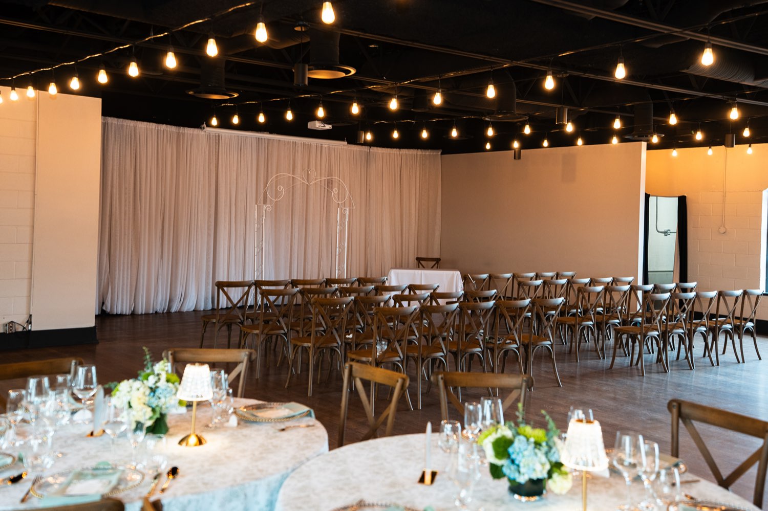 Ceremony seating with draped backdrop