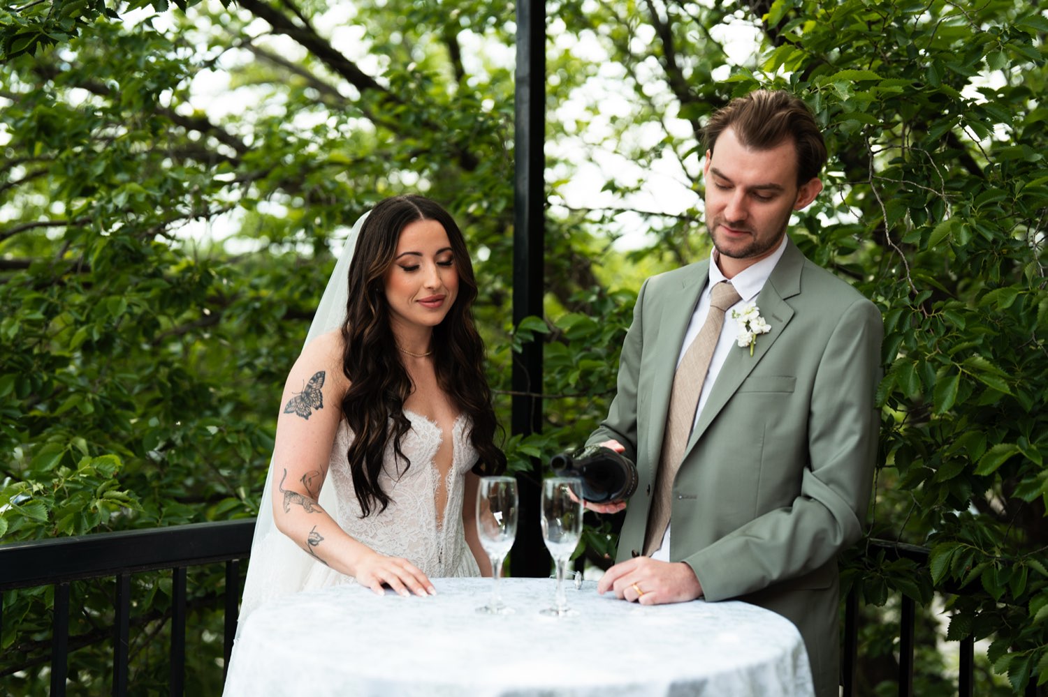 Couple toasting champagne on the patio