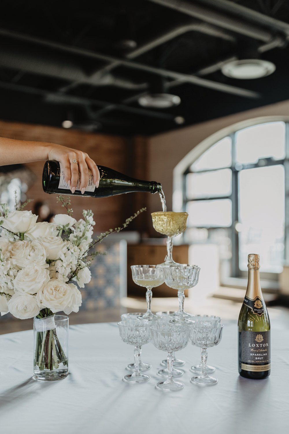 Champagne tower being poured
