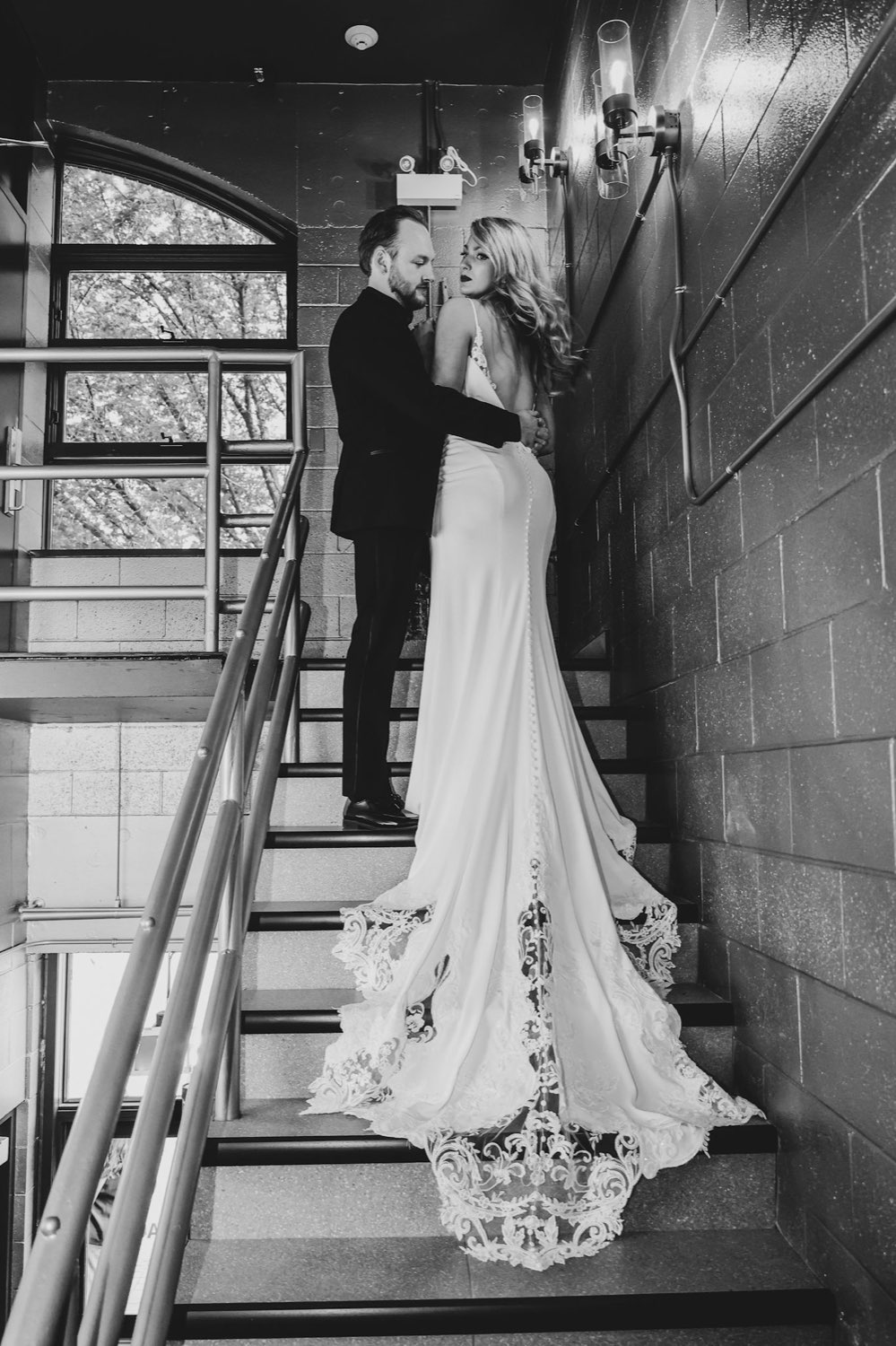 Couple embracing on the stairwell