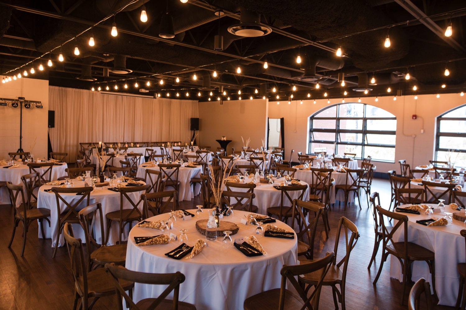 Rustic reception setup with string lights