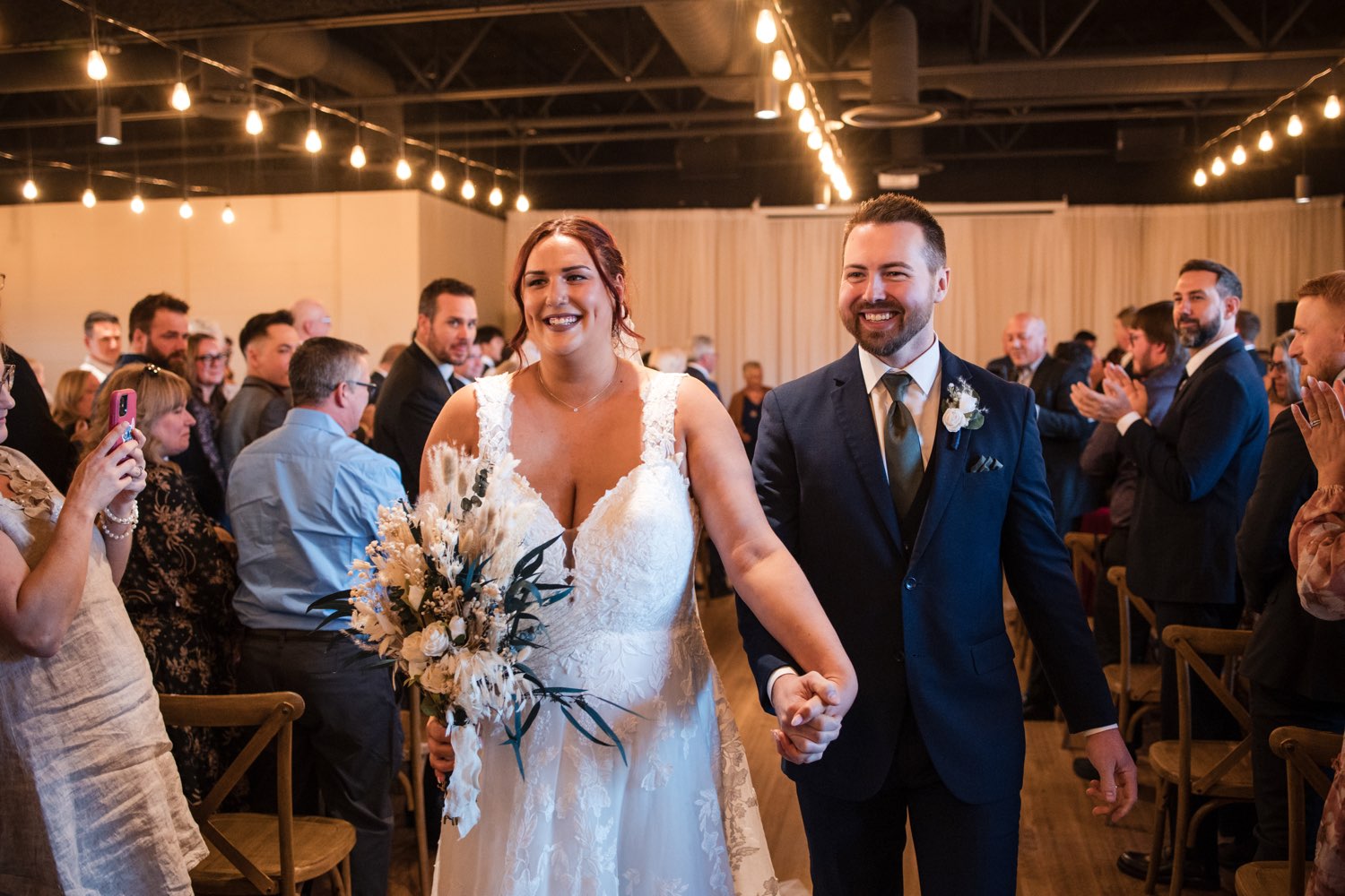 Newlyweds walking up the aisle