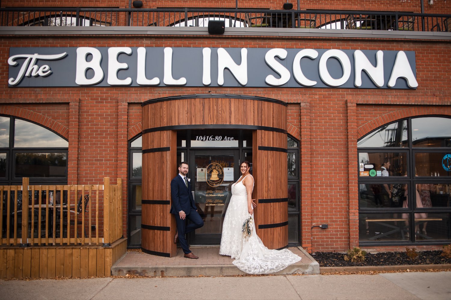 Couple at the front doors of The Bell