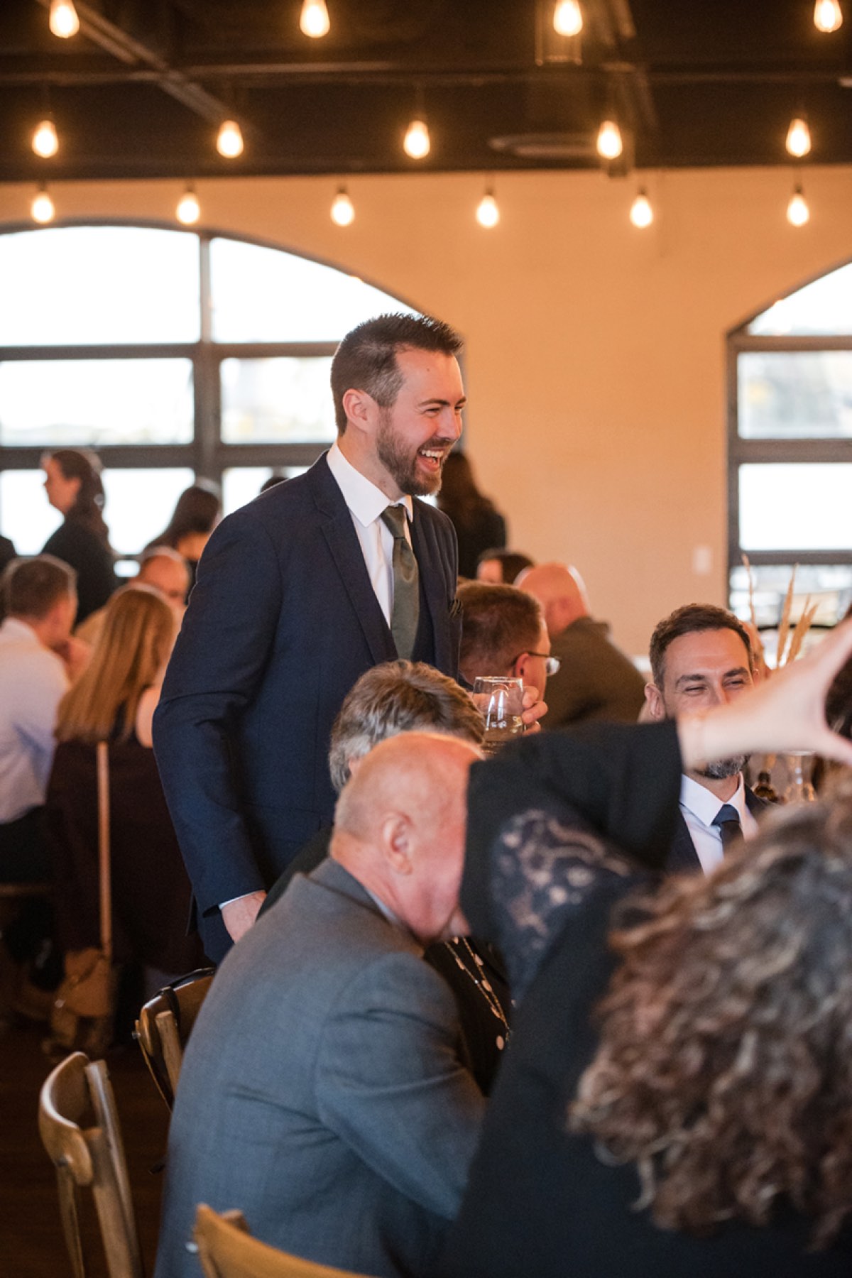 Guests gathered around a table at a private function